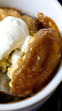 a close up of a bowl of food with ice cream and doughnuts in it