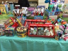 the table is covered with toys and books for children to read or write on it