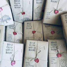 many books wrapped in white paper and tied with twine