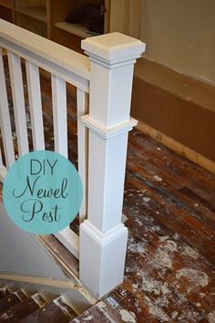 a white railing with a blue sign that says diy newel post