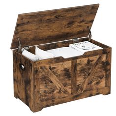 an open wooden storage box with papers in the top drawer and bottom compartment on one side