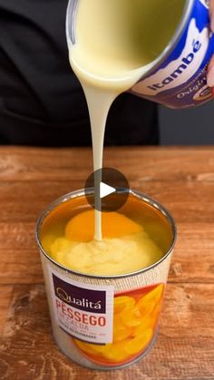 a person pouring cheese sauce into a can