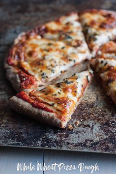 a sliced pizza sitting on top of a cutting board