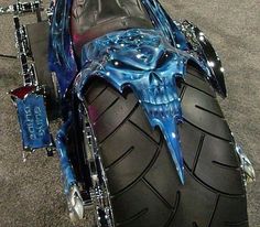 a custom motorcycle with blue paint on it