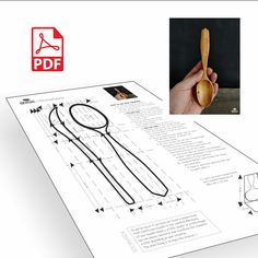 a hand holding a wooden spoon over a piece of paper with instructions on how to use it