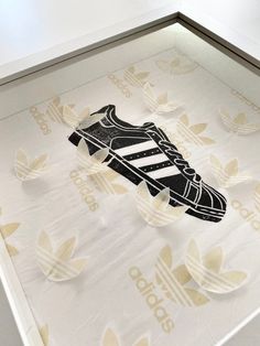 Every time I see the adidas superstars I get butterflies in my stomach, because of the nostalgia inspired by the time in which these iconic sneakers were designed.  There's not a better way to express that feeling, than in a linoleum print on the original adidas tissue paper.  The perfect artwork for any sneakerhead. Superstars Adidas, Iconic Sneakers, Adidas Superstars, Butterflies In My Stomach, Linoleum Print, Adidas Original, Linocut Prints, Linoleum, Linocut