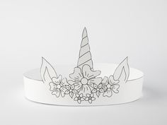 a paper crown with flowers and a unicorn's horn