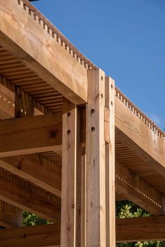 a wooden structure with wood slats on top