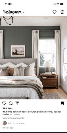 a bed room with a neatly made bed next to a window and a painting on the wall