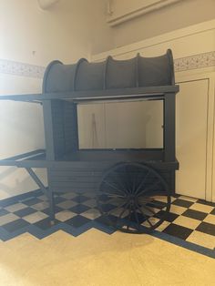 a black and white checkered floor with a horse drawn carriage