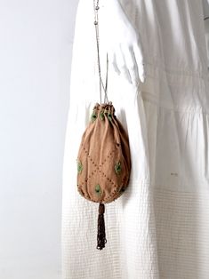 "This is an early 20th century antique evening bag. The drawstring reticule features a plush velvet like tan fabric body with a subtle herringbone weave tan accented with a lovely beaded floral design and brown beaded tassel. A stunning silver tone metal chain with bead accents closes and carries the bag. CONDITION In good condition with wear consistent with age and use. One small brown center floral bead is missing. MEASUREMENTS Length: 8.5\" ... 21.6 cm Width: 6.25\" .. 15.9 cm Drop: 9.5\" .. Jeweled Bag, Hippie Boots, Velvet Purse, Tan Fabric, Upcycle Sewing, Irish Lace Crochet, Silk Yarn, Beaded Tassels, Knitting Inspiration