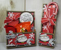 two small boxes with christmas items in them