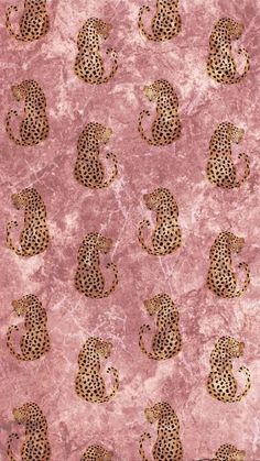 a pink background with gold leopards on it