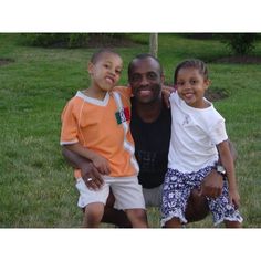 a man and two children posing for a photo