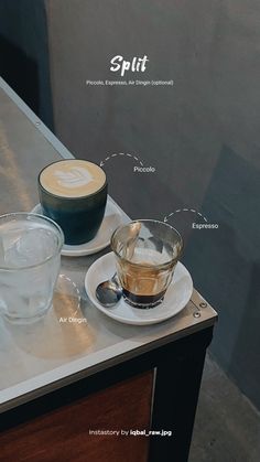 a table with two cups and saucers on it next to an empty glass bowl