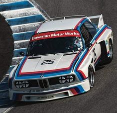 a bmw race car driving on a track