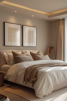 a large bed sitting in a bedroom next to a window with two framed pictures on the wall