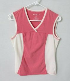 Eddie Bauer pink white sleeveless athletic activewear top *Sz XS*    Excellent condition, no flaws V-neckline Decorative seaming front and back Sleeveless Pullover styling Straight hemline Measurement from shoulder seam to shoulder seam is 14" Chest measurement from side seam to side seam is 17" Length from back of neck to lowest point of hem is 22-1/2" 70% cotton, 30% polyester Machine wash and dry Kept in a smoke free, pet free environment   Make sure you check out Mrs. G's Special Tees sectio Wishlist 2024, Sleeveless Pullover, White Sleeveless, Active Wear Tops, Eddie Bauer, Pullover Styling, Athletic Tank Tops, Pink White, Sleeveless Top