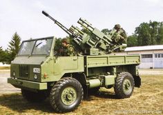 an army truck with missiles on the back