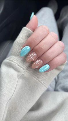 Cute and Trendy: 23 Winter Nails Ideas You’ll Adore This Year. winter nails cute | winter nails black women | winter nails elegant | winter nails classy | winter nails short | winter nails long | winter nails matte | winter nails glitter | snowflake nails | icy nails | holiday nails | winter nails French tip | winter nails minimal | winter nails with rhinestones | cozy sweater nails | winter nails almond shape | winter nails square shape | frosty nails | winter nails red | winter nails green | neutral winter nails Pink Chrome With Snowflakes, Light Blue Nails Snowflakes, Snow Flake On Nail, Winter Blue Snowflake Nails, January Theme Nails, Blue Winter Nails With Snowflakes, Simple Christmas Nail Designs Blue, Blue Chrome Snowflake Nails, Winter Star Nails