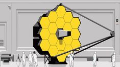 people standing in front of a large yellow object with hexagons on it