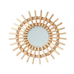 a circular mirror made out of wooden sticks