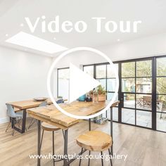 an image of a room with wooden tables and chairs