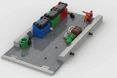 legos are arranged on top of each other in an area with different colored blocks