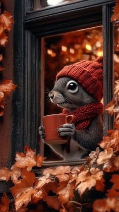 a squirrel wearing a red hat and scarf is holding a coffee cup in front of a window