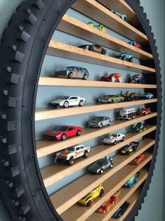 there are many toy cars on the shelves