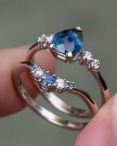 two rings with blue and white stones on them