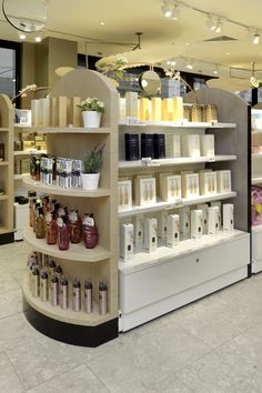 the inside of a store with shelves filled with products