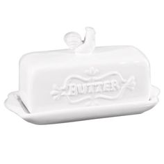 a white butter dish with the word butter on it