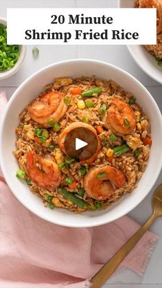 shrimp fried rice in a white bowl with chopsticks and green onions on the side