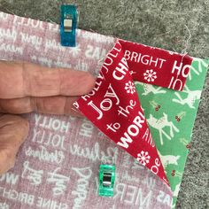 someone is stitching together fabric to make a christmas ornament