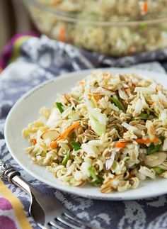 a white plate topped with rice and veggies