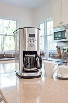 a coffee maker sitting on top of a kitchen counter