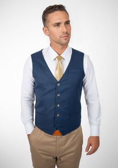 Experience classic styling and modern finesse wearing the Prussian Blue Pinstripe vest. Featuring a vibrant blue hue with subtle pinstripes, this custom made vest will make you feel vibrant and confident. Elegant Tailored Pinstripe Vest, Elegant Pinstripe Vest For Formal Occasions, Classic Pinstripe Formal Vest, Classic Pinstripe Vest For Formal Occasions, Elegant Pinstripe Business Vest, Elegant Blue Vest, Elegant Blue Sleeveless Vest, Tailored Pinstripe Business Vest, Tailored Pinstripe Vest For Business