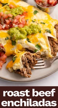 a plate topped with meat and guacamole covered in salsa next to a fork