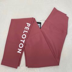 Brand : Peloton Color : Red (More Of A Muted Red Or Dark Pink) Style : Flex Legging With Peloton Down Calf Of Right Leg Material : 82% Polyester 18% Spandex Length : 35.5” Waist To Ankle Waist : 9” At Top Of Band / 10.5” Bottom Of Band Rise : 9.5” Condition : Nwt (Only Taken Out Of Plastic For Pics) Ordered Wrong Size & Waited Too Long To Return Matching High Neck Bra In Xs Also Available. Bundle For A Discount! Offers Welcome : No Trades Smoke Free : Pet Friendly Home Peloton Leggings, Peloton Apparel, Flex Leggings, High Neck Bra, Dark Pink, Pink Fashion, Pant Jumpsuit, Bra, Pants For Women