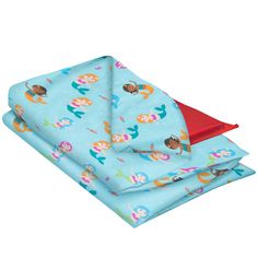 a blue blanket with mermaids on it and red trim around the edges is folded