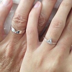 two people with wedding rings on their fingers