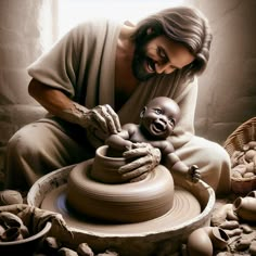 a man holding a baby in front of a potter's wheel