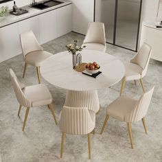 a white table with four chairs around it in the middle of an open floor plan