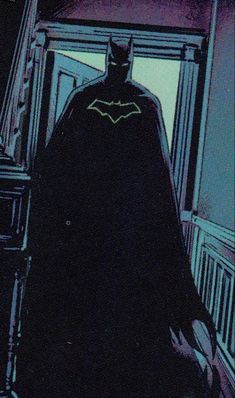 a batman standing in front of a window at night