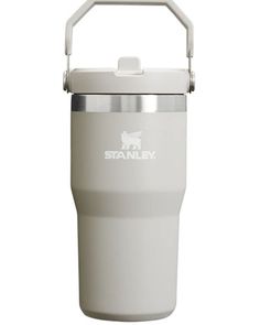 the stanley stainless steel insulated cup is white and has a metal handle on it