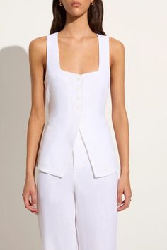 The Maya Vest in White offers a feminine and modern take on the classic vest style. Thoughtfully cut from European Flax® linen, it features a square neckline, four-button front closure, open front hem and a back waist tie for a custom fit. Pair it with the Isotta Pant for a tailored two-piece set. Vest Style, Maxi Dress Sale, Faithfull The Brand, Vest White, Vest Fashion, Shop Maxi Dresses, Linen Women, White Fashion, Vest Top