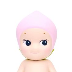 a small doll with big blue eyes and a pink hat on it's head