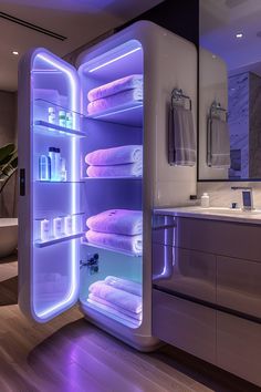 an open refrigerator filled with lots of white towels