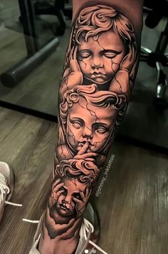 a woman's leg with some tattoos on it